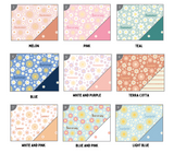 a bunch of different colored papers with flowers on them